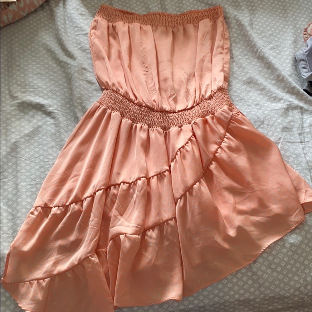 Strapless asymmetrical hem dress from the buckle.